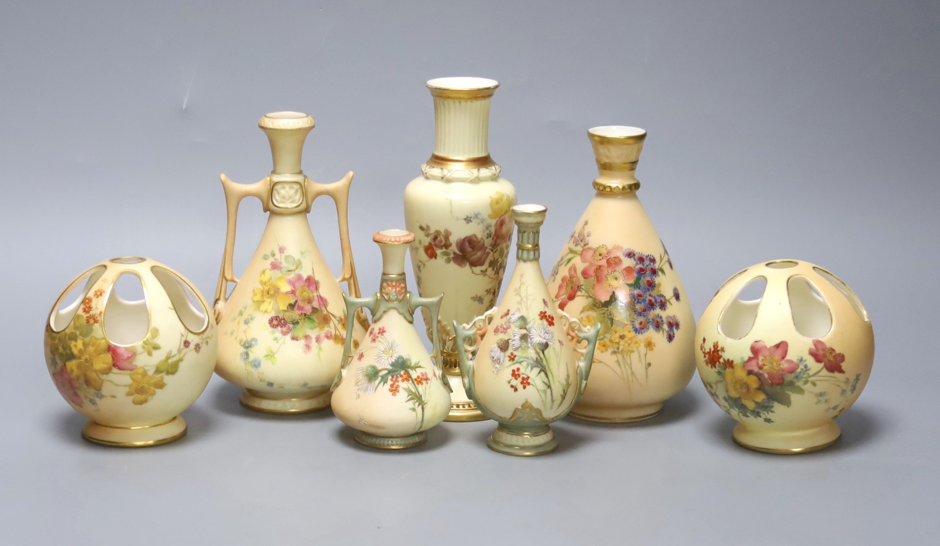 A small group of Royal Worcester blush ivory - a pair of globe pot pourri, a pair small vases and three vases, 17cm